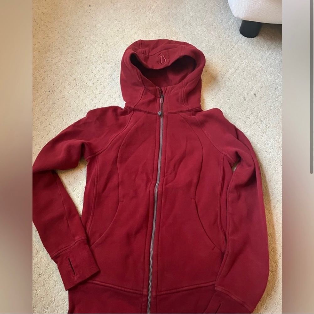 selling a red lululemon full zip scuba. gently worn. size 2, great condition.